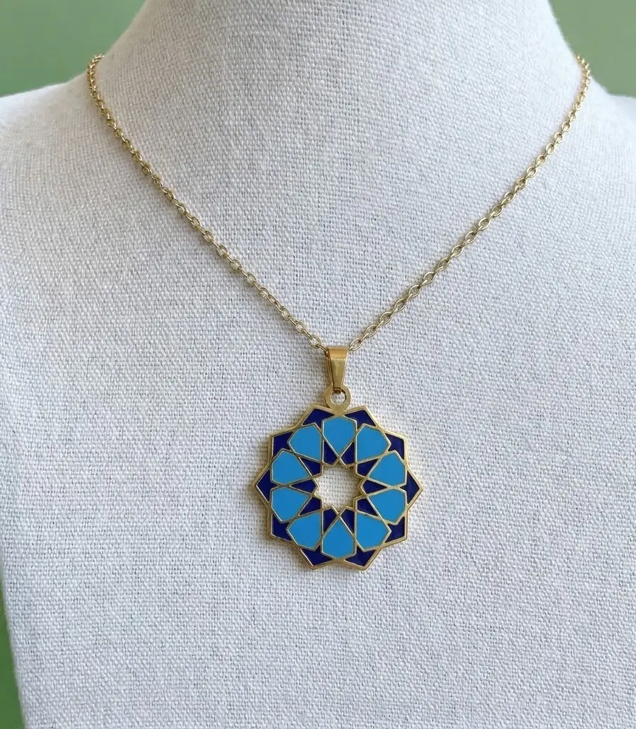 Handcrafted Mediterranean geometric rosette tile pendant necklace with blue and navy enamel in gold plating