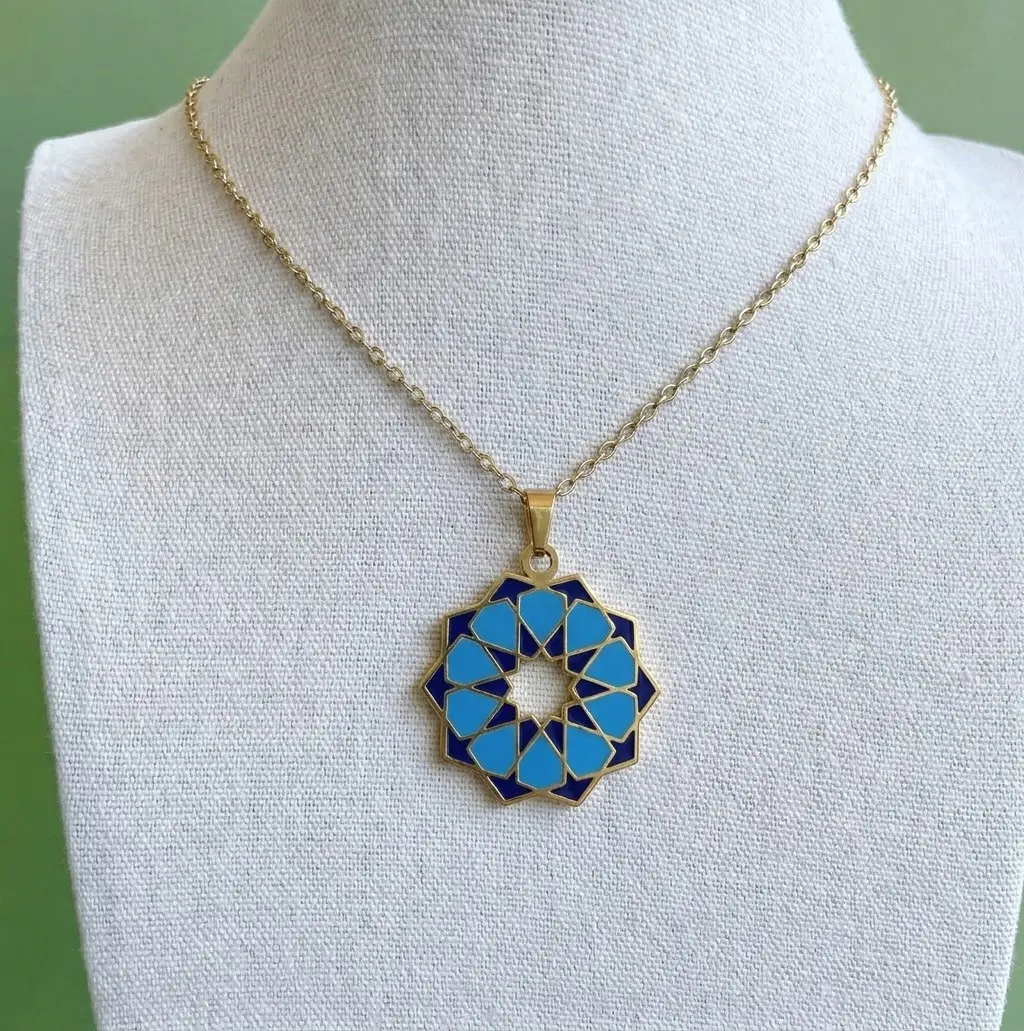 Handcrafted Mediterranean geometric rosette tile pendant necklace with blue and navy enamel in gold plating