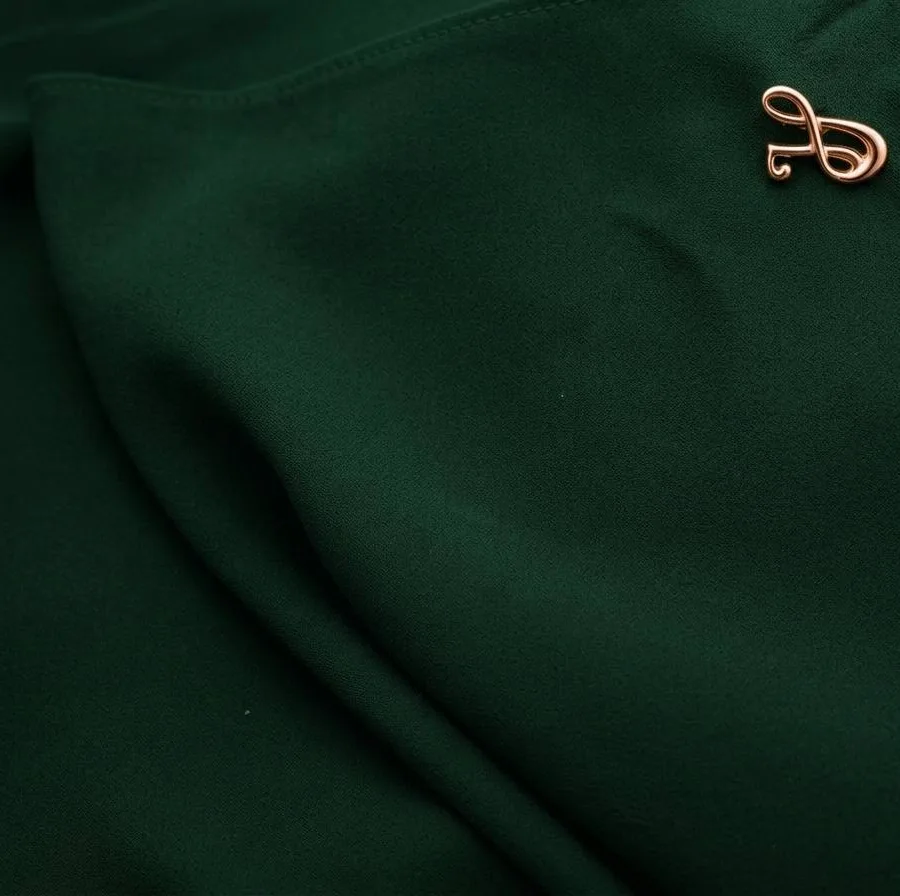 Textured premium chiffon hijab fabric in forest green with neat finished edges