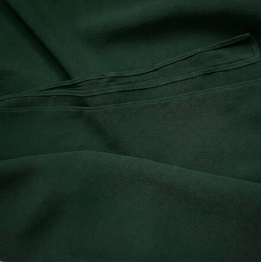 Textured premium chiffon hijab fabric in forest green with neat finished edges