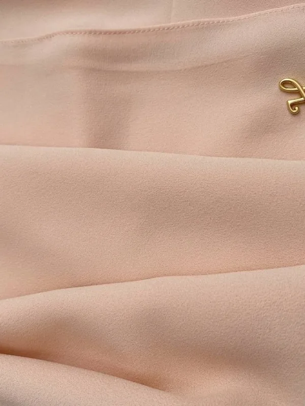 Soft blush pink premium chiffon hijab fabric close-up showing light texture and drape