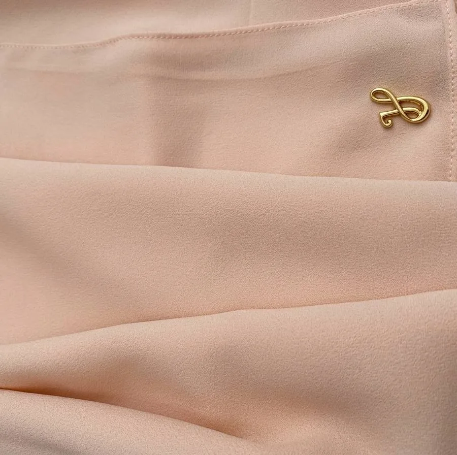 Soft blush pink premium chiffon hijab fabric close-up showing light texture and drape
