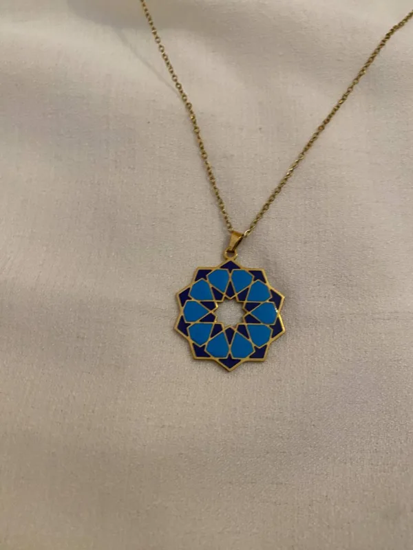 Handcrafted Mediterranean geometric rosette tile pendant necklace with blue and navy enamel in gold plating