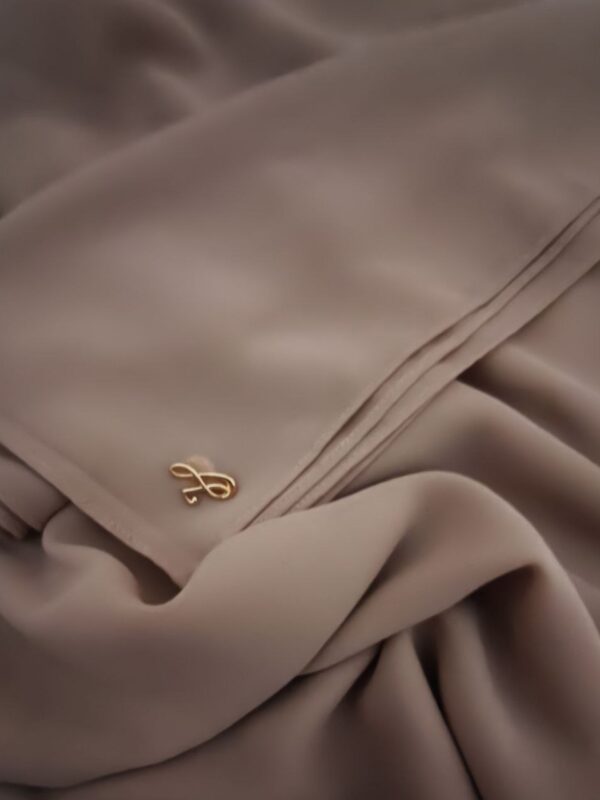 Warm hazelnut golden brown neutral premium chiffon hijab with signature gold charm