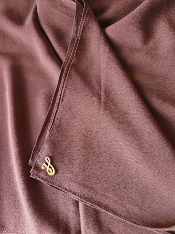 Warm terracotta earthy brown red premium chiffon hijab with signature gold charm