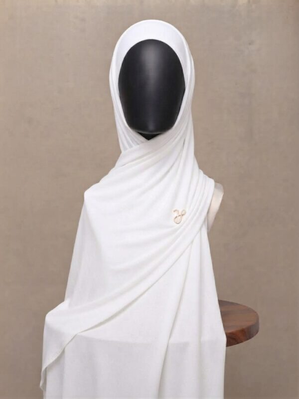 Crisp white premium cotton jersey hijab with signature gold charm