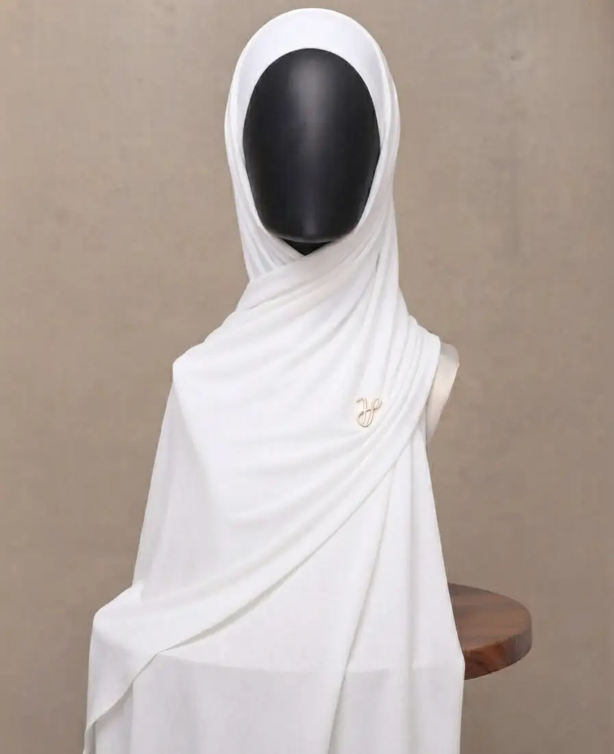 Crisp white premium cotton jersey hijab with signature gold charm