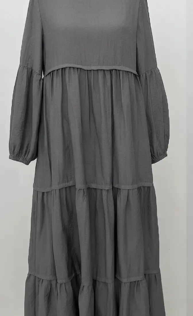 full view of grey rayon-linen muslim dress with a full cotton lining, showing off its natural drape.