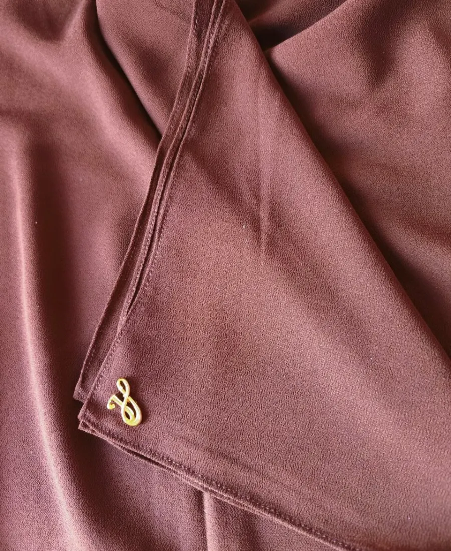 Warm terracotta earthy brown red premium chiffon hijab with signature gold charm